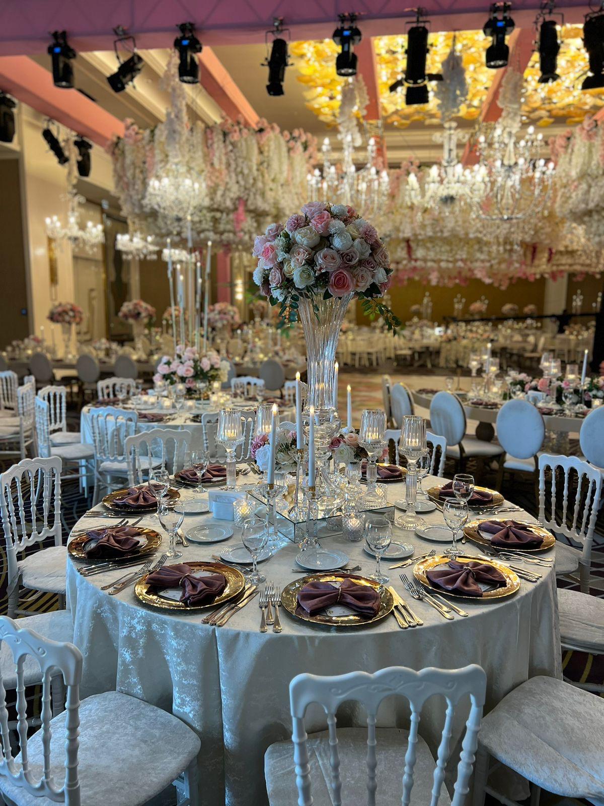Wedding tablescape with glass, florals and suspended crystal details